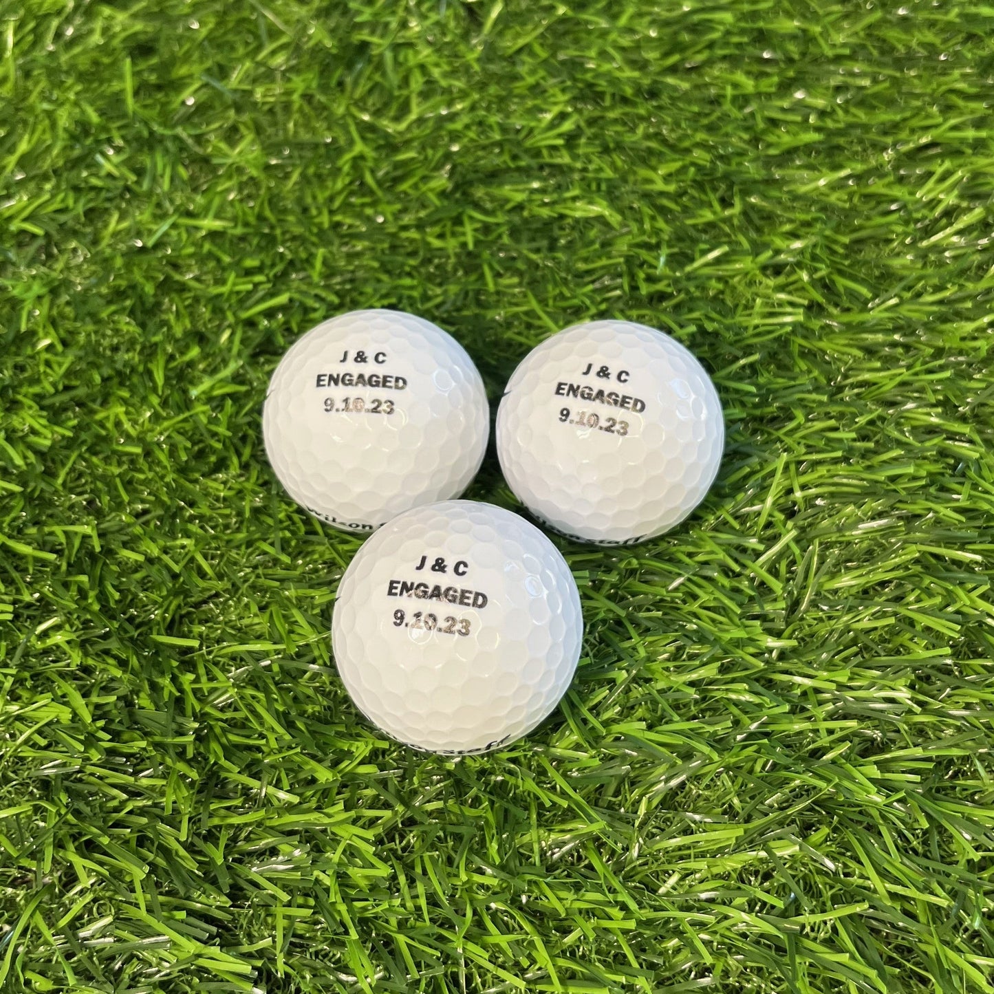 Customized Golf Balls with Black Text Three Balls
