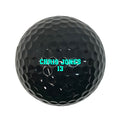 Load image into Gallery viewer, Customized Personalized Black Golf Ball Varsity Team Font in Glow in the dark
