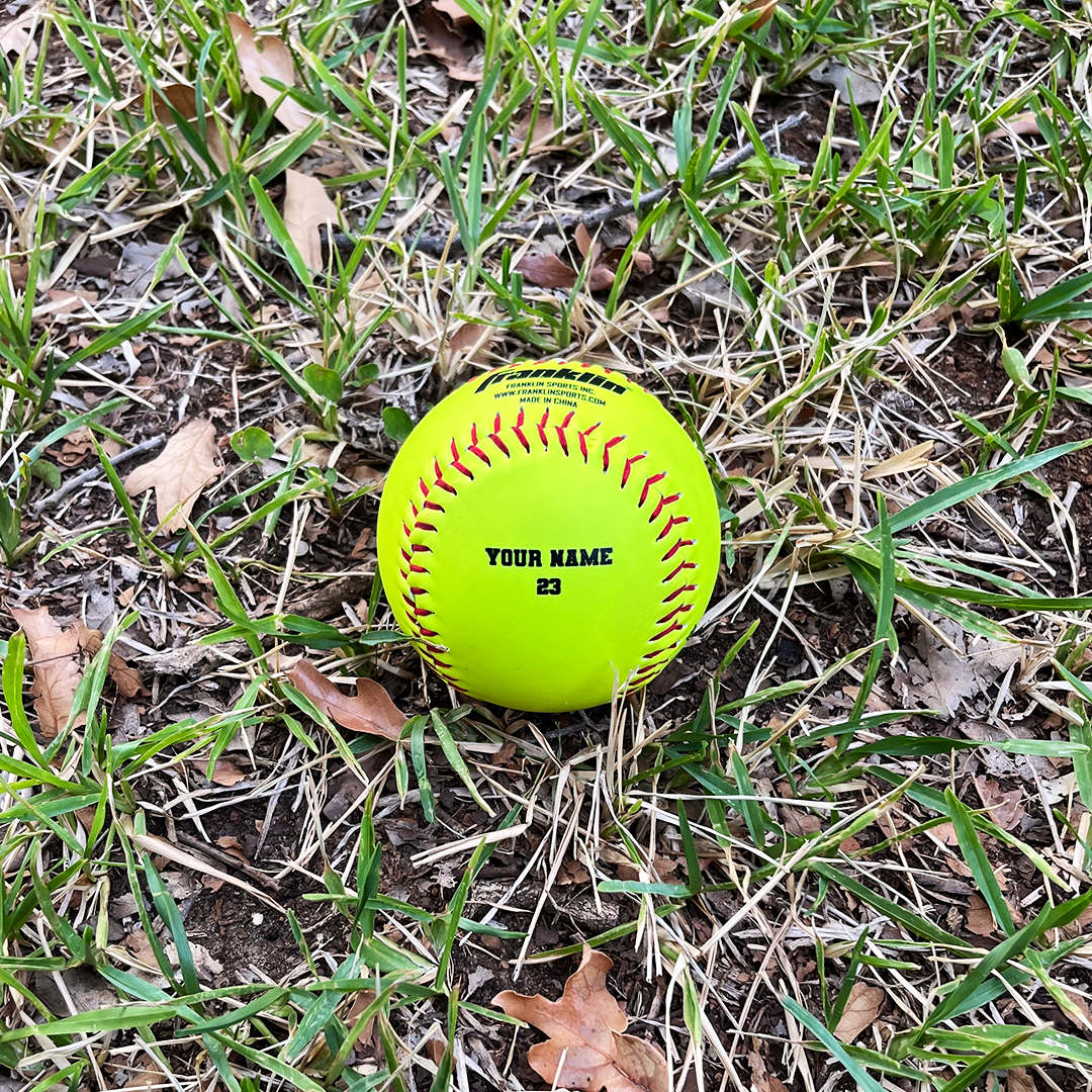 Personalized Softball with Your Name on Grass Background