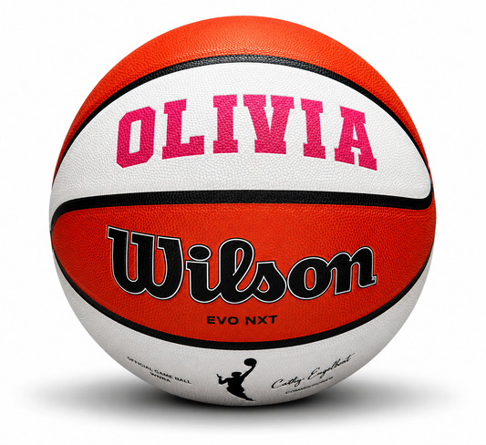 Customized WNBA Official Game Basketball with custom text written on the top panel in pink color.