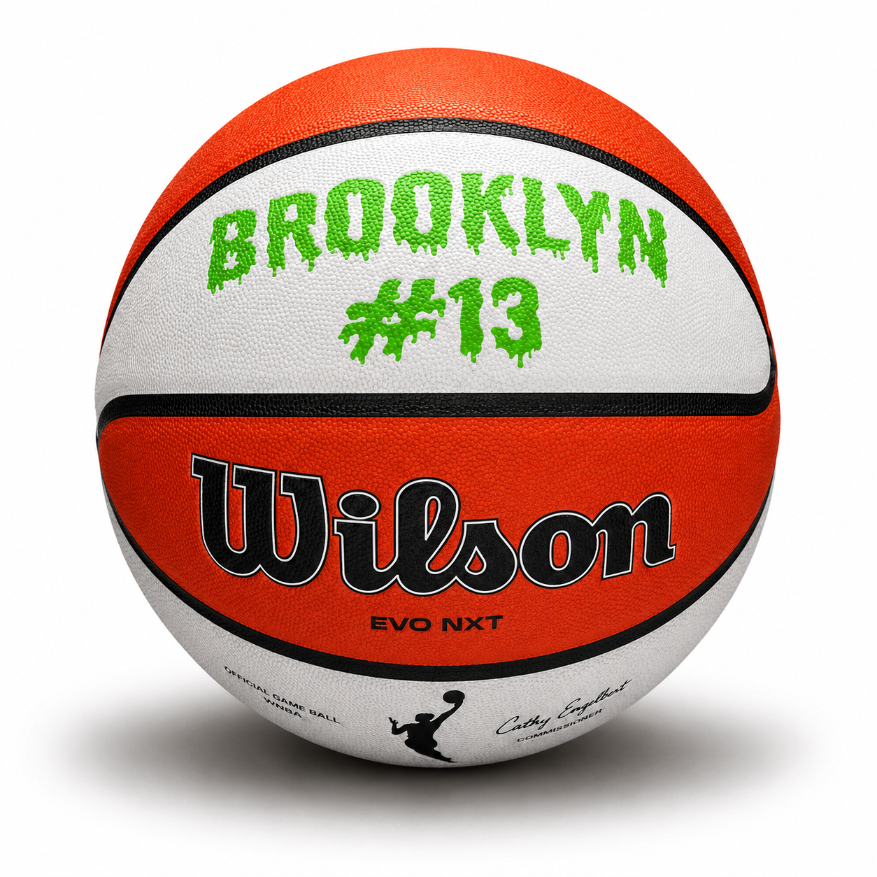 Customized WNBA Official Game Basketball with custom text written on the top panel in bright green color.